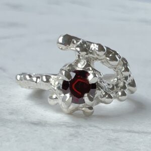 Sterling silver molten ring with a 6mm natural garnet