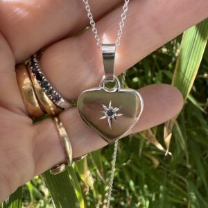 Sterling silver heart set with a 2.5mm blue sapphire