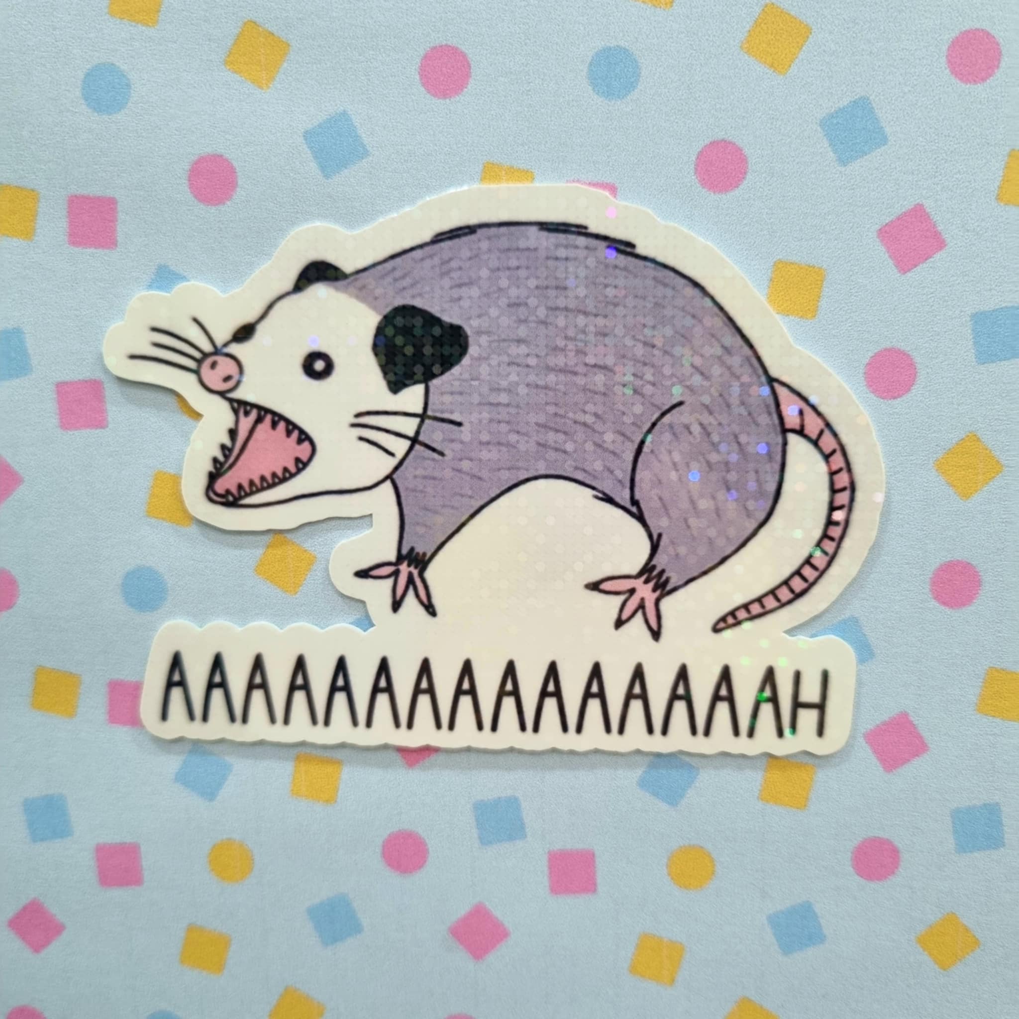 Pick 'n' Stix - Aaaaah-possum Holographic Vinyl Sticker by The Ugly Mug Co. Pick 'n' Stix - Aaaaah-possum Holographic Vinyl Sticker by The Ugly Mug Co.