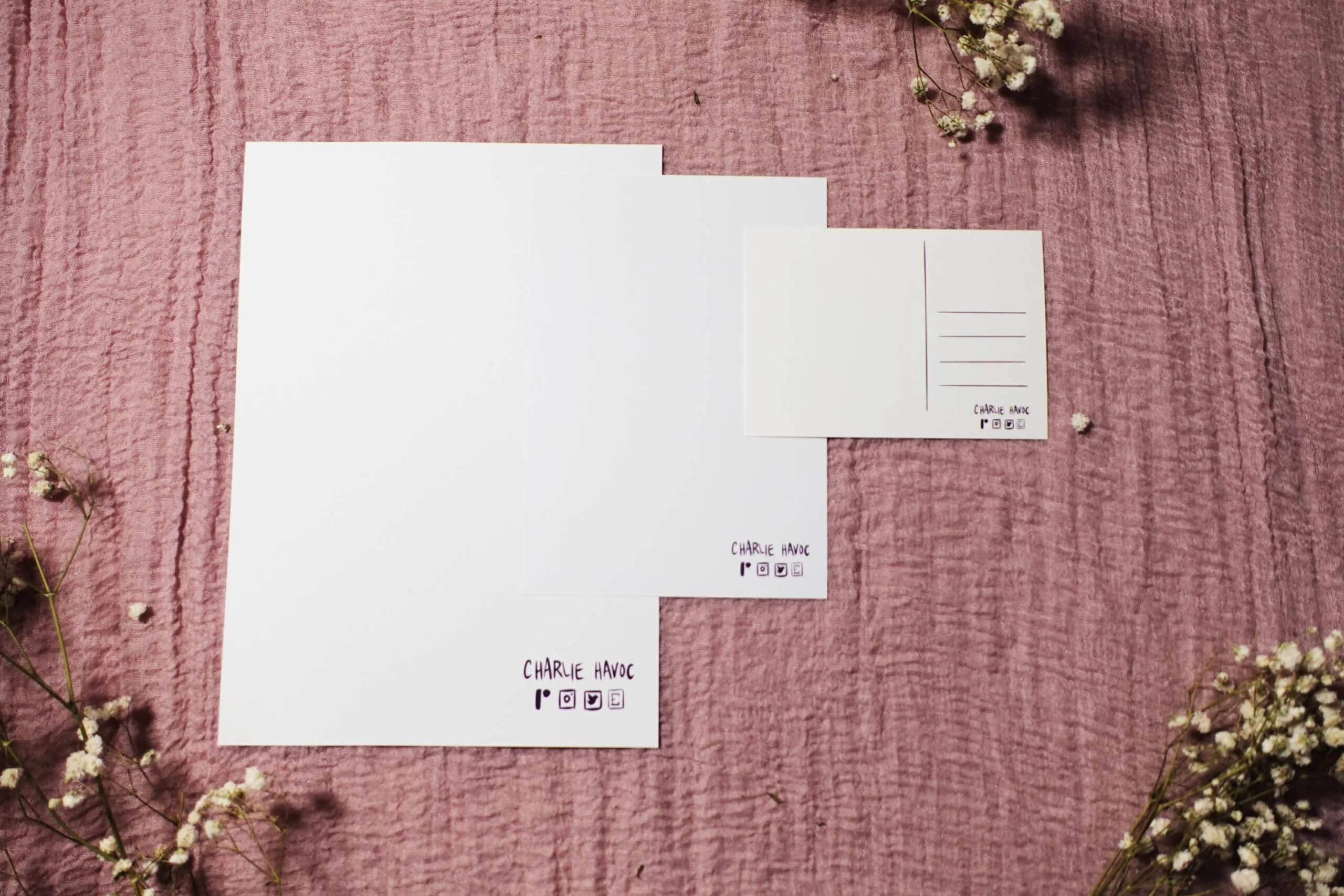 Thanatos and Zagreus postcard print by Charlie Havoc photograph showing the back of an A4 print, an A5 print, and a postcard print side by side