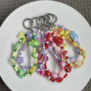 Colourful acrylic bead bag charm with dinosaur bead and pastel round beads