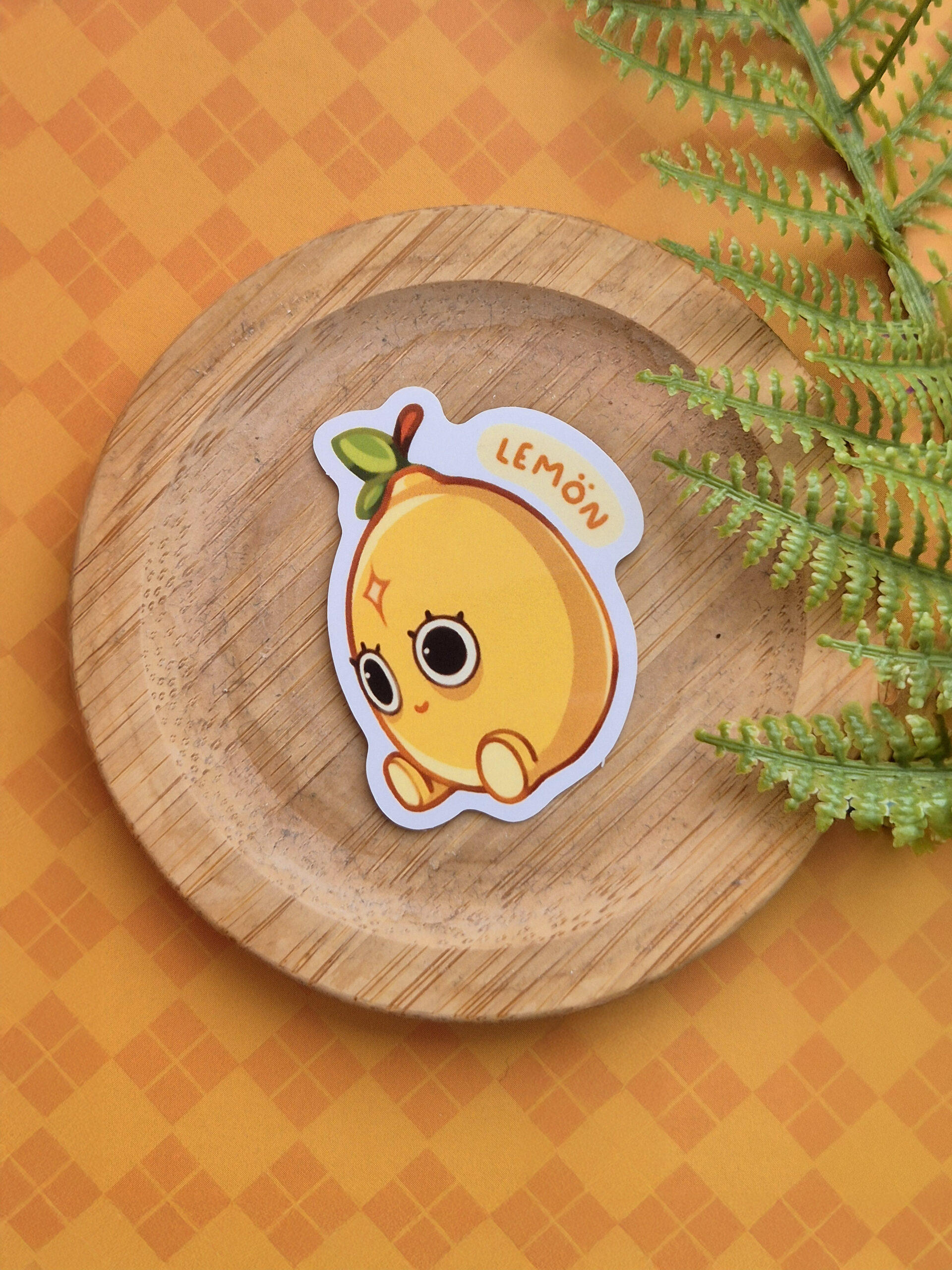 Lemön: Vinyl Weatherproof Sticker by Vauliys Vinyl sticker of a lemon sitting with dilated pupils with a 4 pointed star on it's forehead.