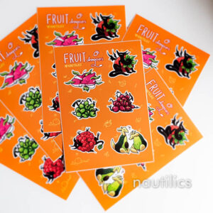 Photo of a sticker sheet labelled Fruit Dragons. It contains 6 designs of different common fruit, reimagined as if they were also little dragons. The fruit includes dragonfruit, strawberry, two colours of grapes, raspberry, and avocado.