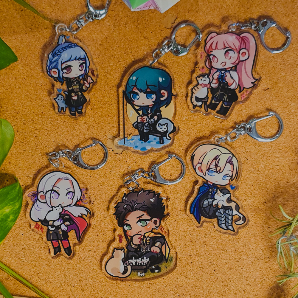 Fire Emblem: Three Houses Acrylic Charms by Nautilics Photo of acrylic charms of characters from Fire Emblem: Three Houses. The characters include Edelgard, Claude, Dimitri, Byleth, Hilda, and Marianne