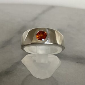 Chunky sterling silver ring flush set with an orange garnet. Mens pinky ring