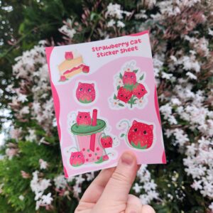 Add a sweet and whimsical touch to your belongings with this Strawberry Cat Sticker Sheet! This adorable sheet features 5 unique designs of playful cats transformed into strawberries—lounging in desserts, sipping boba drinks, and more. Perfect for cat lovers, stationery fans, or anyone who enjoys cute, quirky accessories.