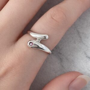 Pink garnet silver wrap around ring.